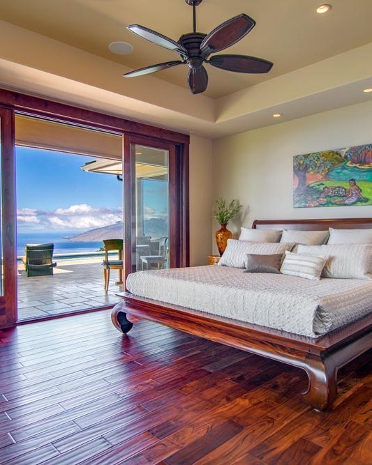 Master suite opening directly onto a private lanai with an ocean view